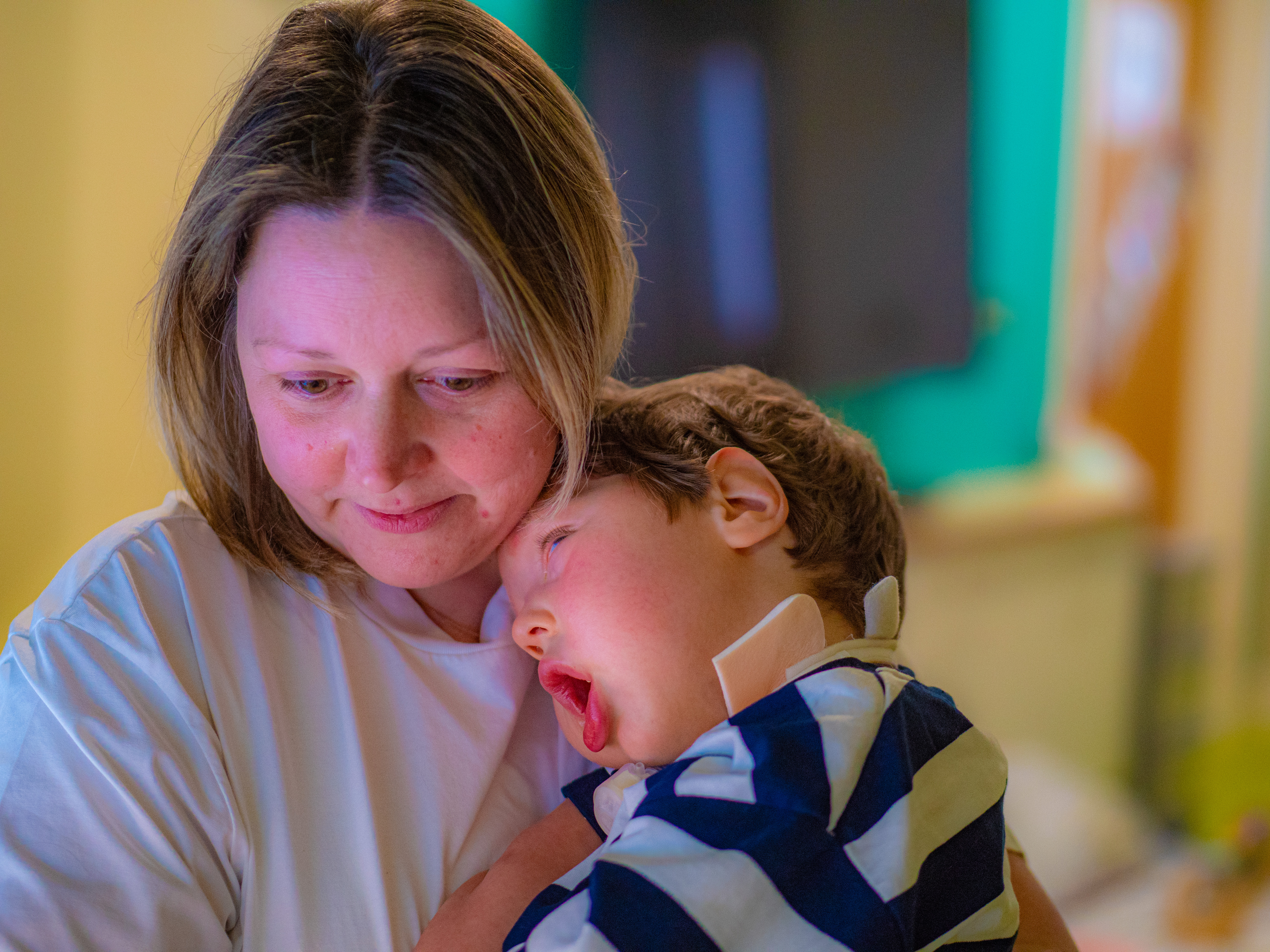 Mum and son hugging and being together