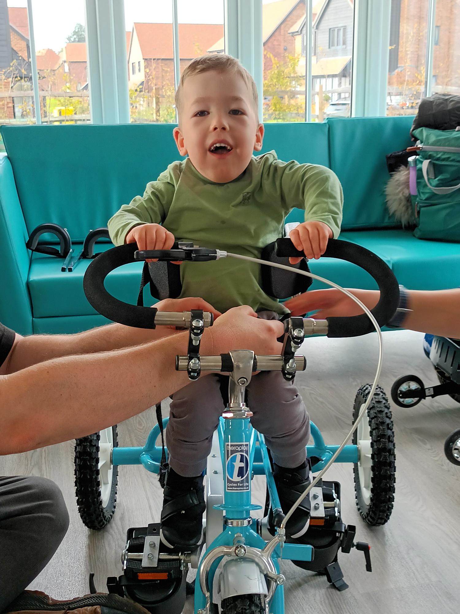 Child using tricycle