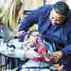 Child and family with dinosaur toy