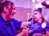 Image of sensory play with child and staff