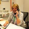 An admin volunteer working reception at SEL