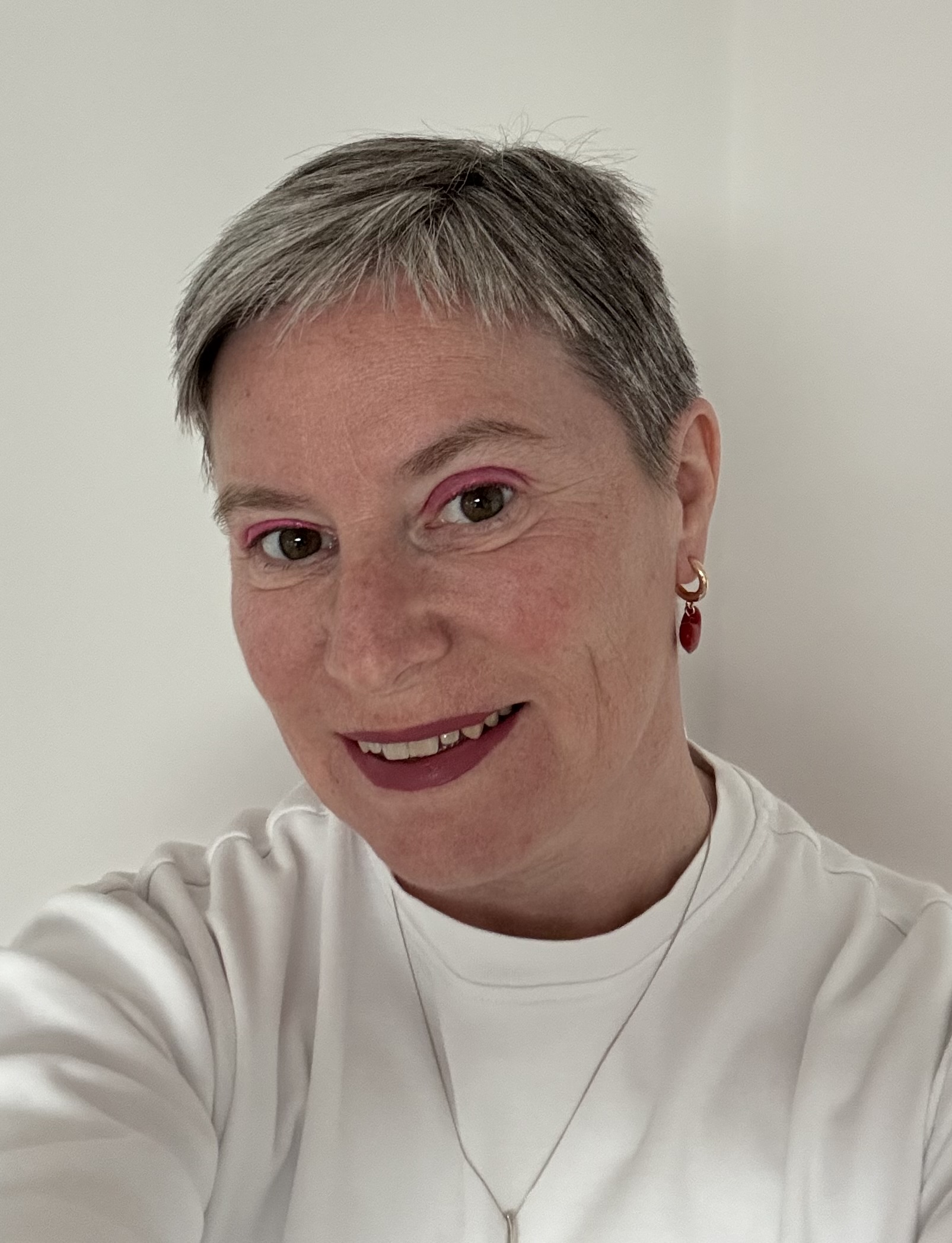 Trustee Charlotte Parry Jones smiling at the camera, wearing a white top