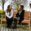 Fundraising Staff having a chat on a bench