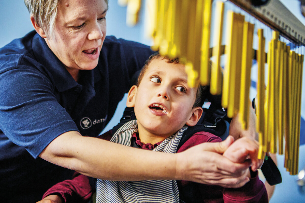 Helen And Isaac Playing Wind Chimes 