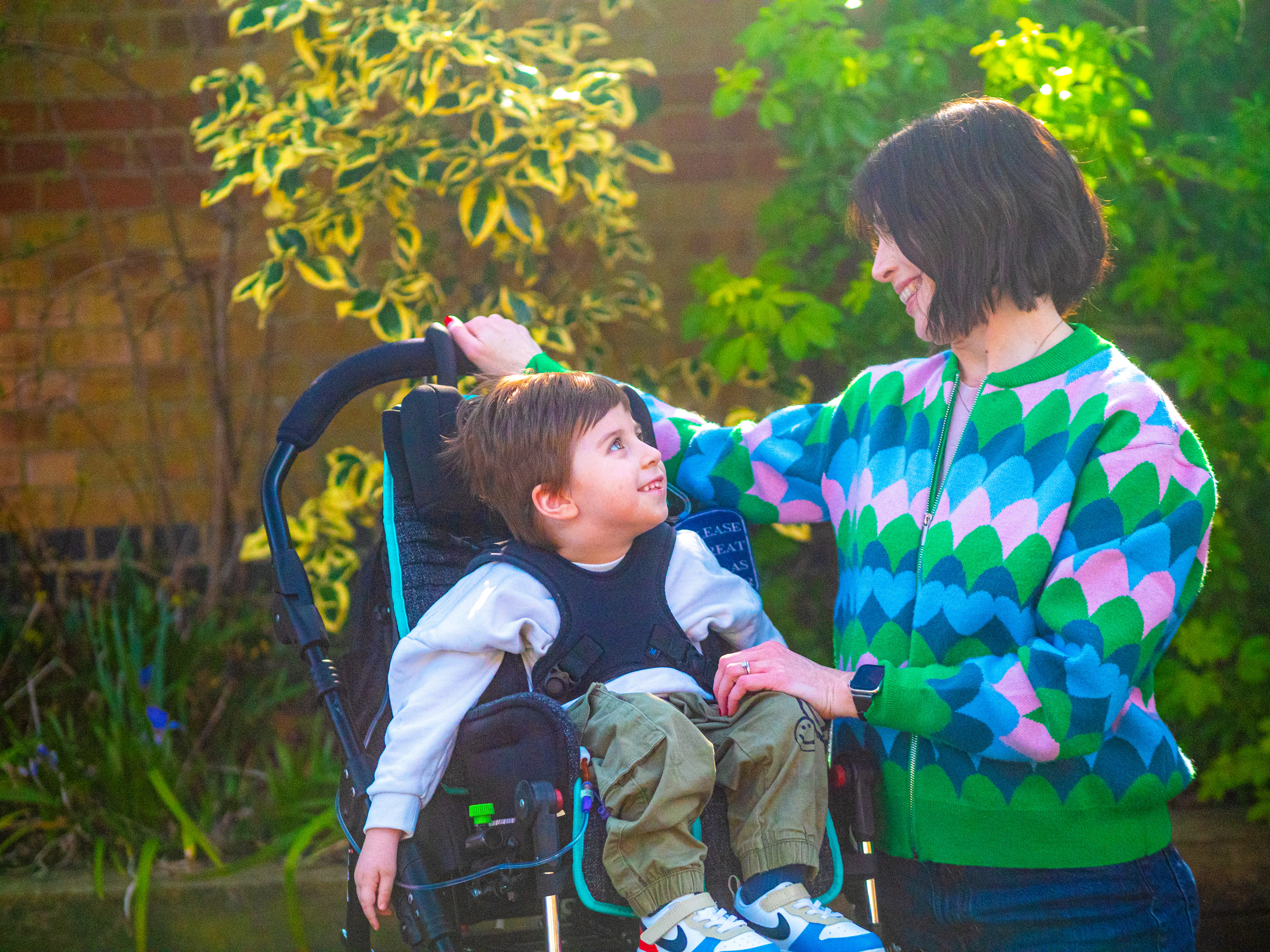 Mum and son looking at each other and smiling