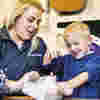 Image of child and staff doing memory making