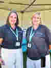 Two female members of the Family Engagement Team smiling while standing at East Sussex Discovery Day 2025